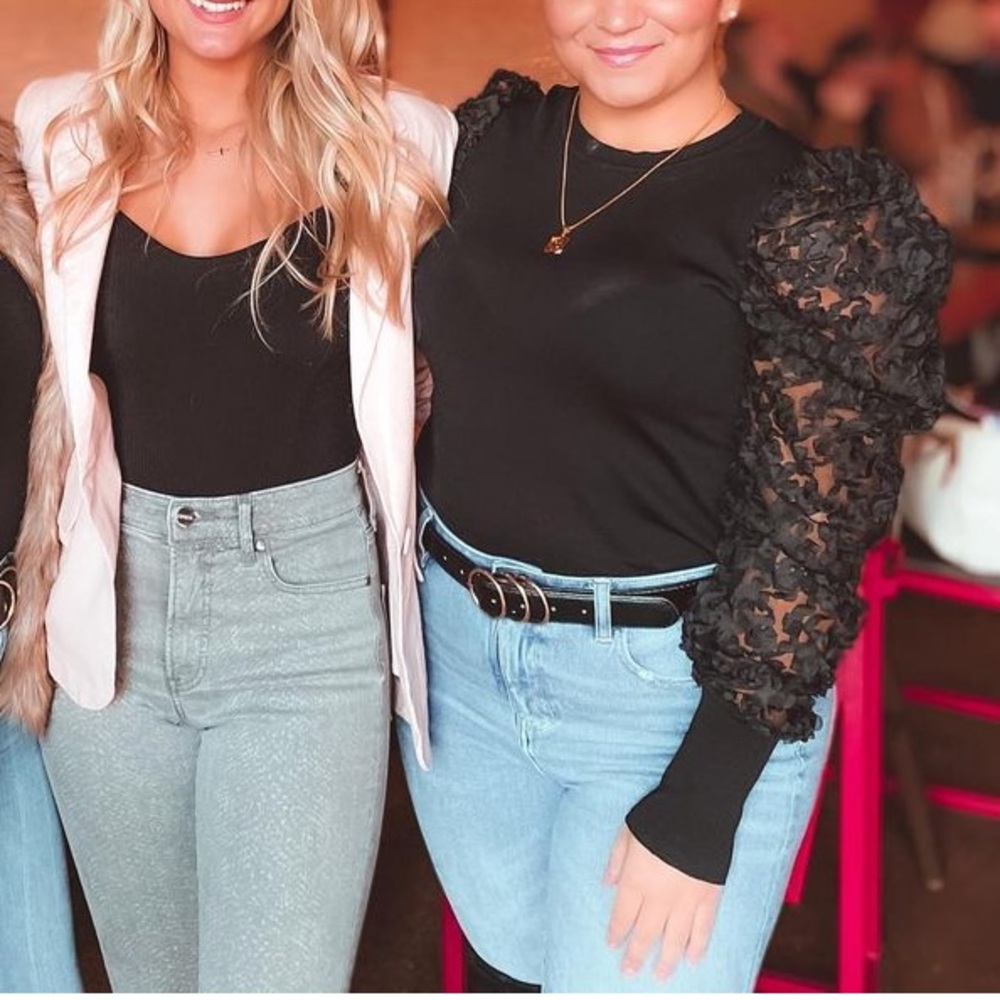 Black puffer sleeve top with eyelet details